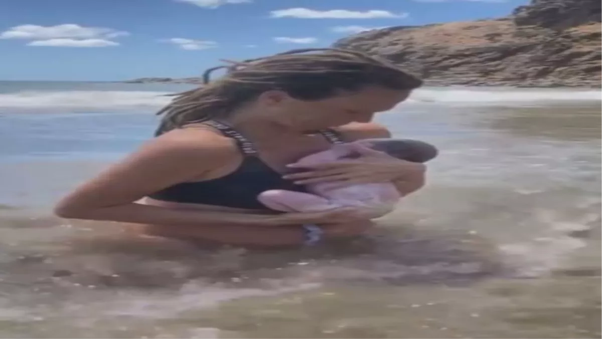 Viral Video: महिला ने समुद्र की लहरों के बीच दिया बच्चे को जन्म, सोशल मीडिया पर छाया मां-बेटे का वीडियो