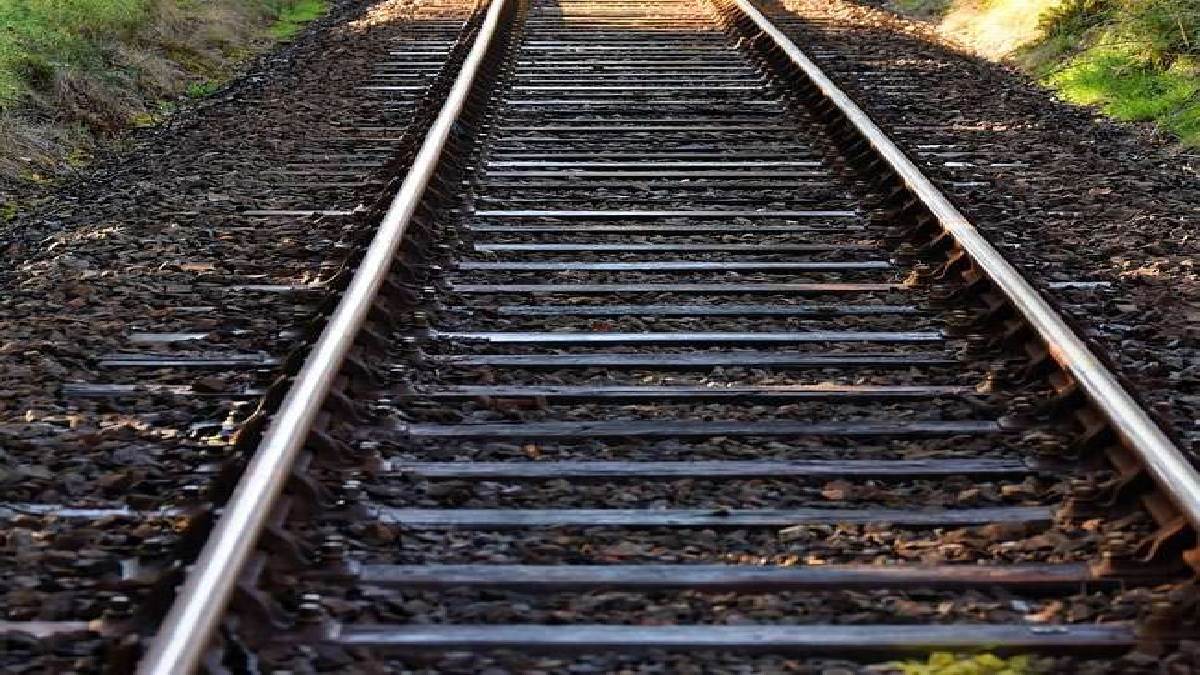 ghazipur bike collided with train while crossing railway tracks young man saved his life by jumping