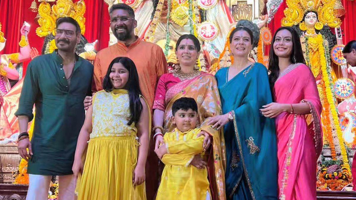 ajay devgn kajol launch new logo of their production house at maha navami durga pooja2025