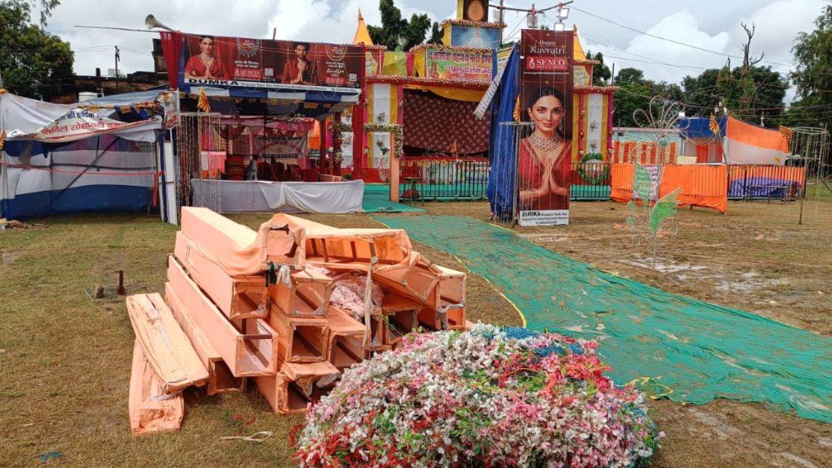 dumka durga puja dampened by rain woman dies vendors worried