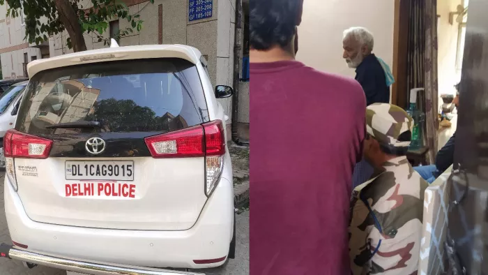 पत्रकार उर्मिलेश को ले जाती पुलिस टीम। जागरण