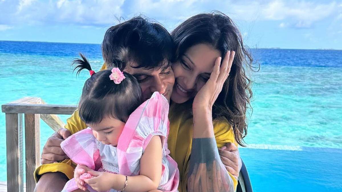 bipasha basu birthday actress kiss karan singh grover in the ocean while holding daughter devi in maldives on her birthday