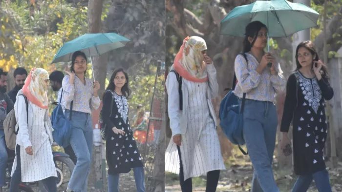 UP Weather News:कड़ी धूप से बचाव को लेकर छाता लेकर गोवि. परिसर में छाता के साथ निकलती युवतियां। संगम दूबे