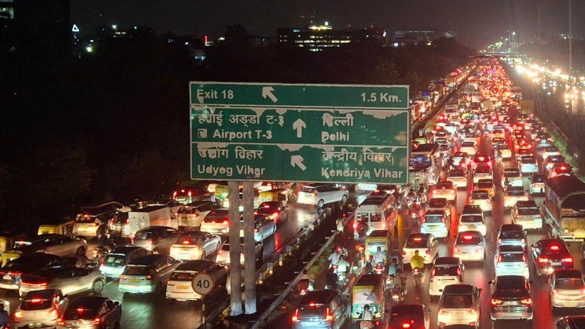 ncr gurugram rain weather turns dark clouds cause traffic jams