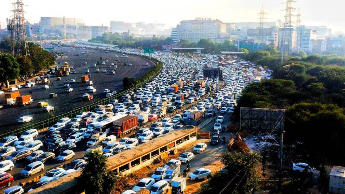 ncr gurugram rain weather turns dark clouds cause traffic jams