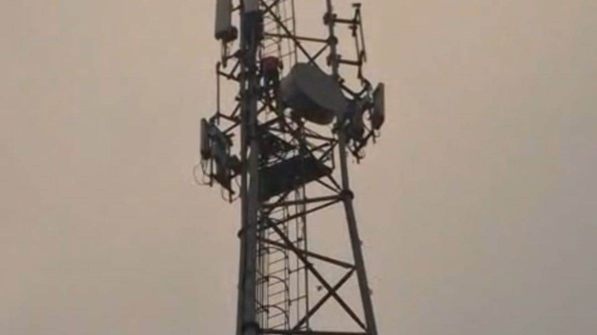 mau news man climbs mobile tower after dispute threatens suicide