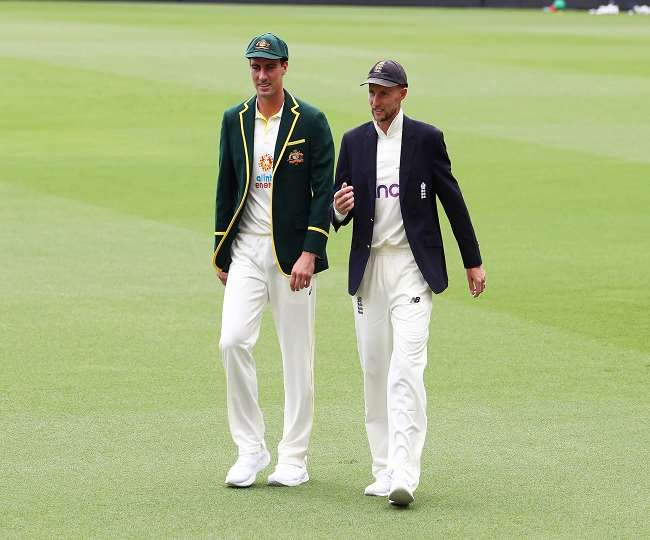 आस्ट्रेलिया और इंग्लैंड के कप्तान पैट कमिंस और जो रूट (एपी फोटो)
