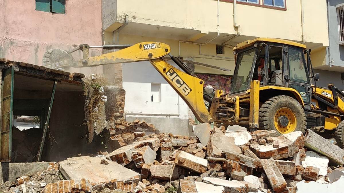 railway bulldozer action encroachments removed in baidyanathdham for station renovation