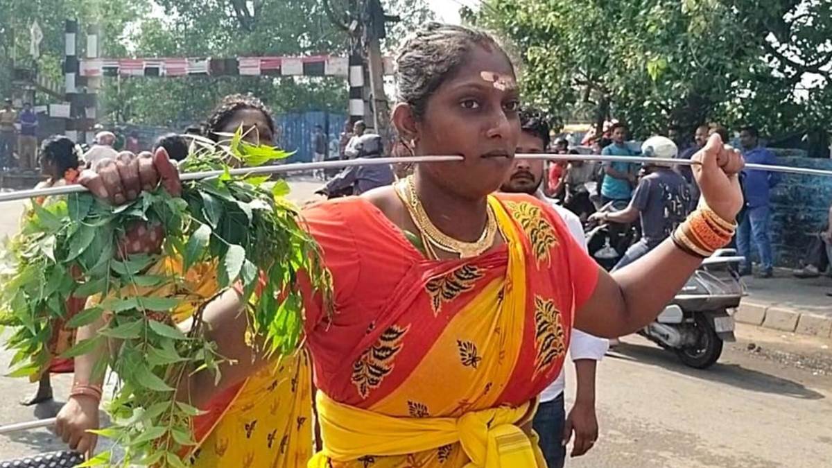 ncr on pongal festival in delhi devotees walked on embers and passed tridents across them