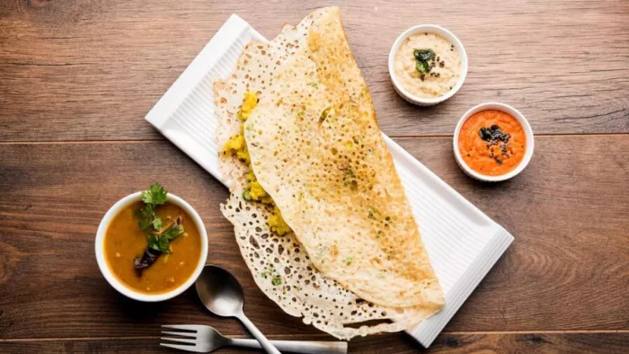 Rava Dosa Recipe: रवा डोसा बनाने की शानदार रेसिपी (Image Source: Freepik)