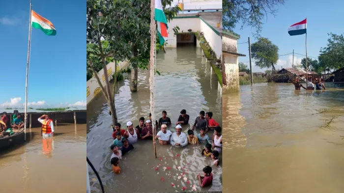 पानी में खड़े होकर स्कूलों में फहराया गया झंडा
