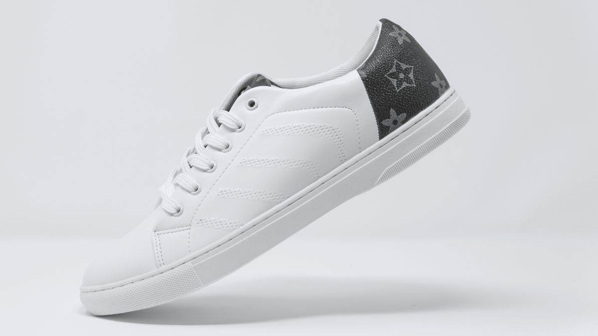 Men's GG embossed sneaker in white and black leather | GUCCI® US