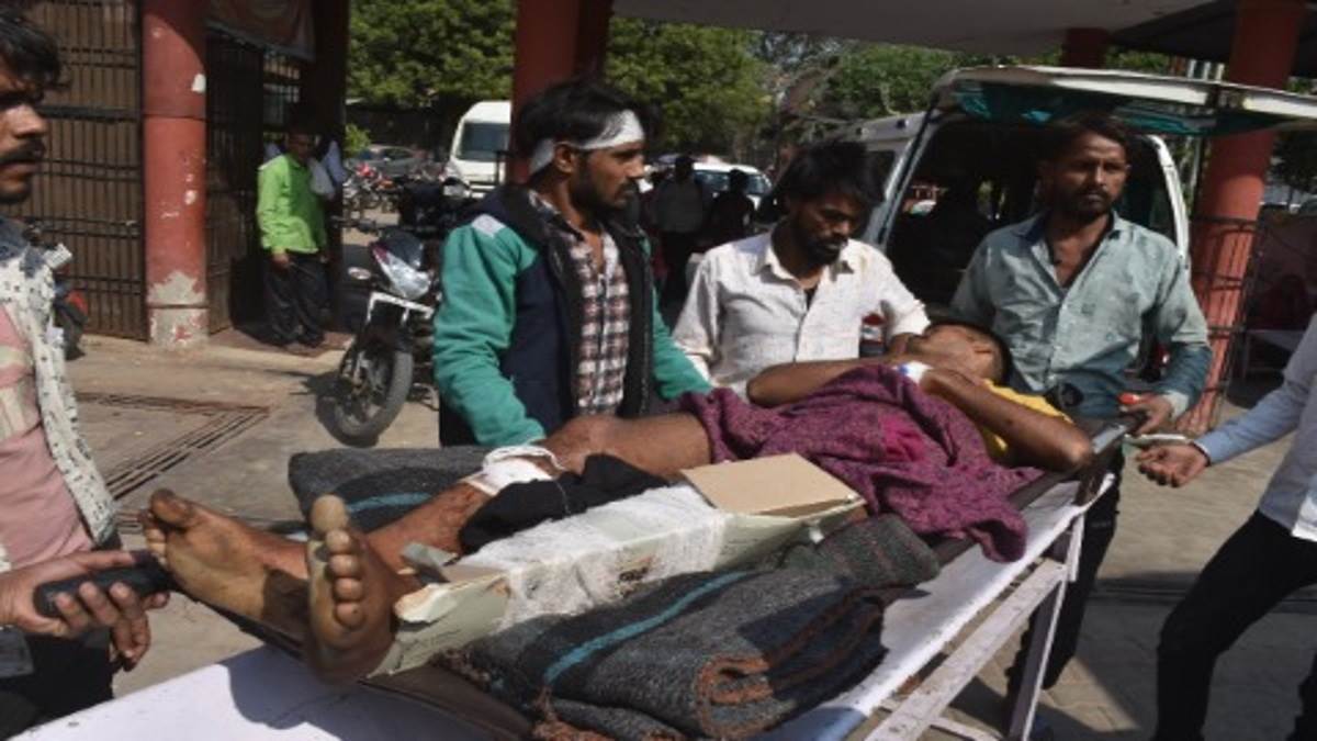 in hathras paper cardboard tied on leg of a young man instead of plaster