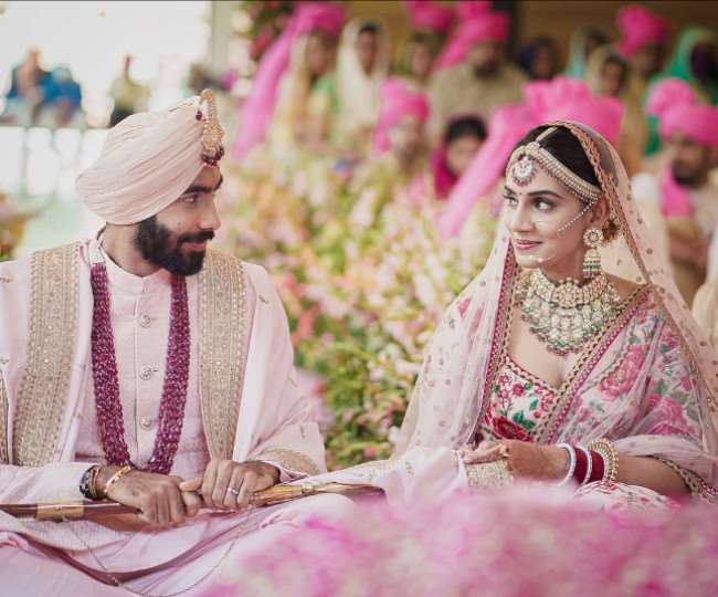 Jaspreet Bumrah and his bride Sanjana Ganesan royal look is perfect for a  day wedding