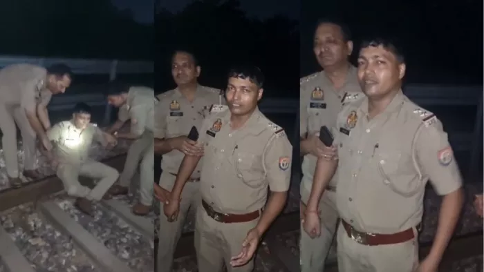 ट्रैक पर आत्महत्या करने पहुंचे दारोगा को हटाती पुलिस टी। वीडियो से ली तस्वीर।