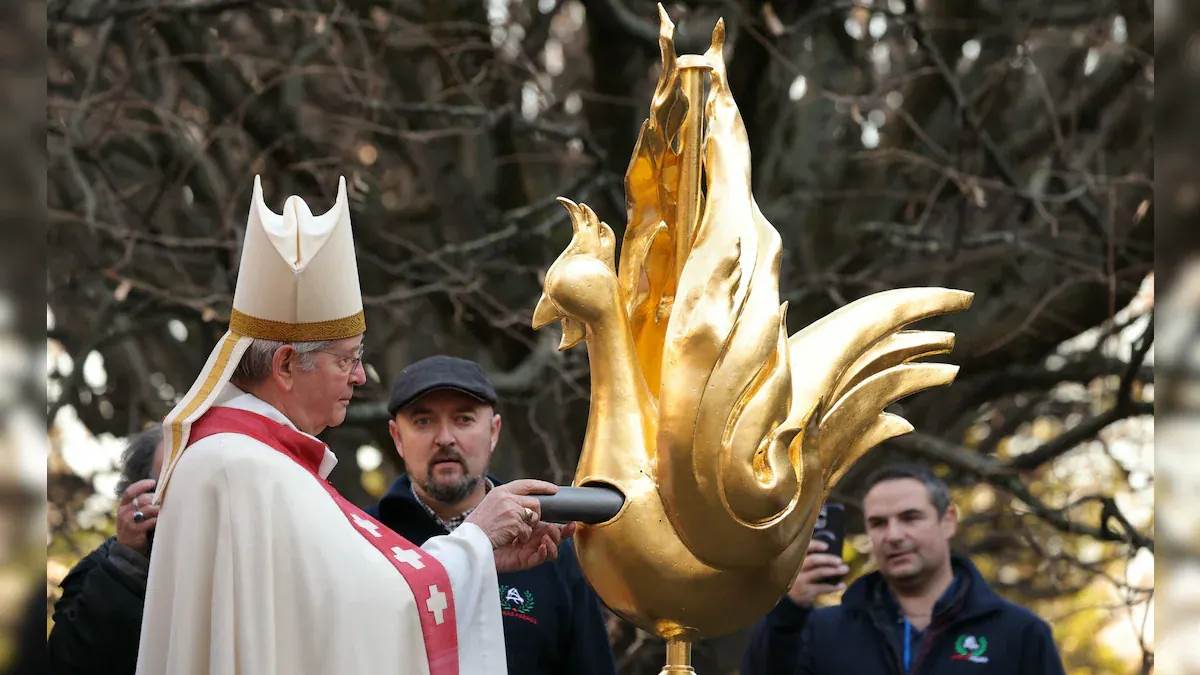 paris new golden rooster fitted to spire of paris notre dame cathedral