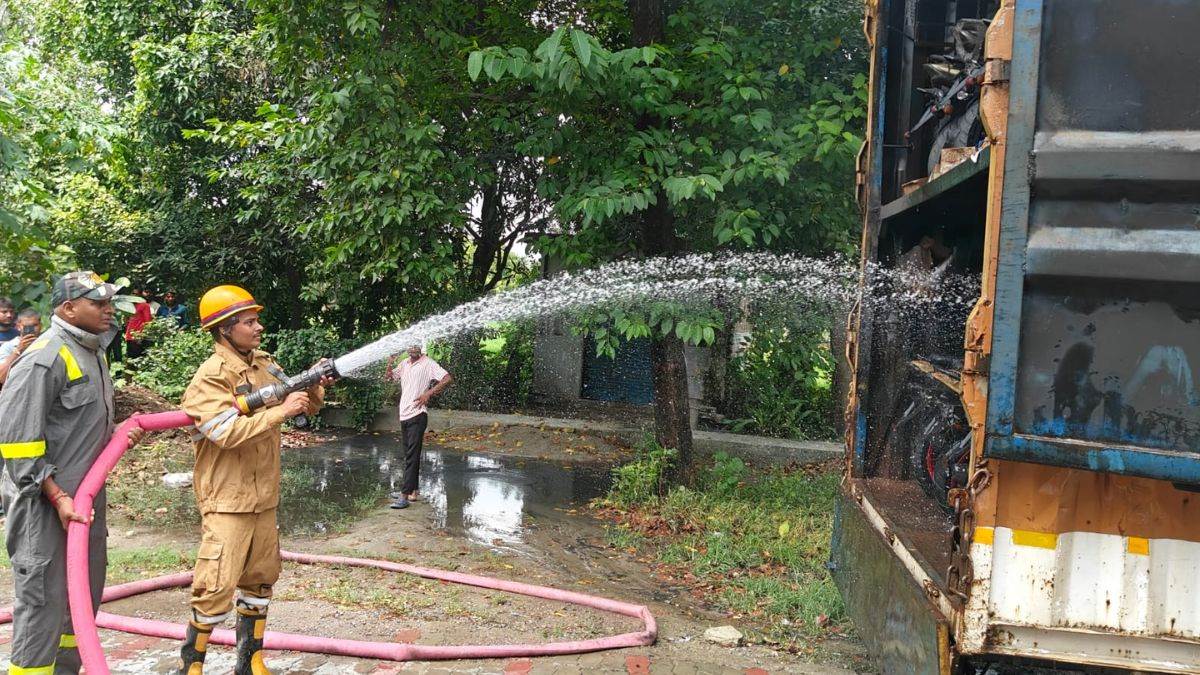 ayodhya news container carrying bikes catches fire after contact with high tension wire