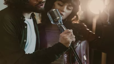 https://www.jagranimages.com/images/newimg/19092024/19_09_2024-stock-photo-close-shot-young-couple-performing-song-vintage-microphone.jfif