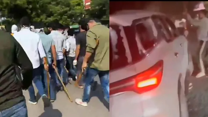 रामजस कॉलेज के बाहर डंडे लेकर जाते युवक, डूसू चुनाव के दौरान कार को तोड़ते युवक। वीडियो ग्रैब।