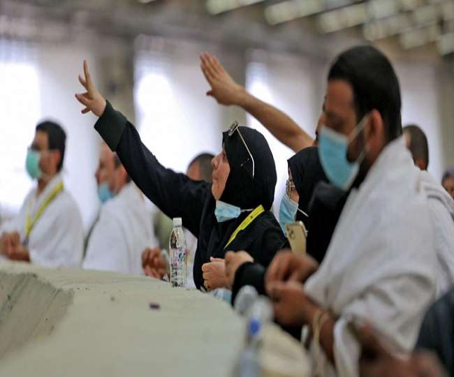 Pilgrims stone the devil with sanitized pebbles in hajj ritual