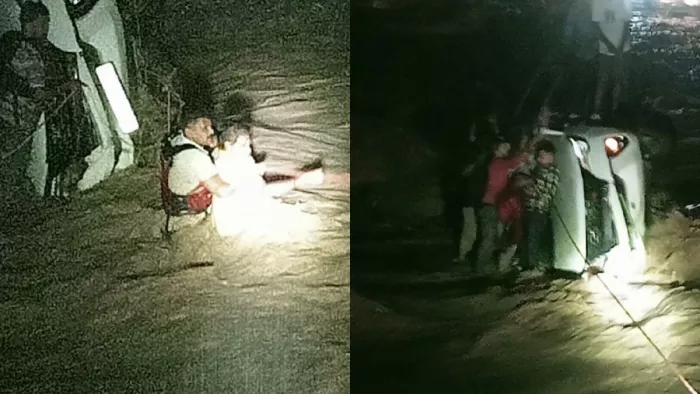 शेर नाले में फंसे कार सवारों को निकालते पुलिसकर्मी। वीडियो ग्रैब