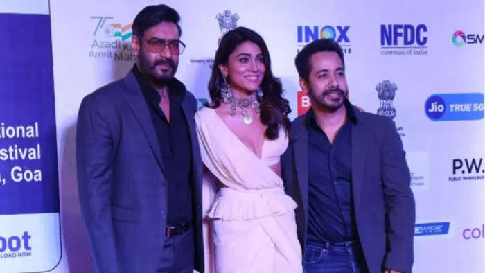IFFI 2022: Drishyam 2 team visit to participate at 53rd film festival give posed on red carpet.