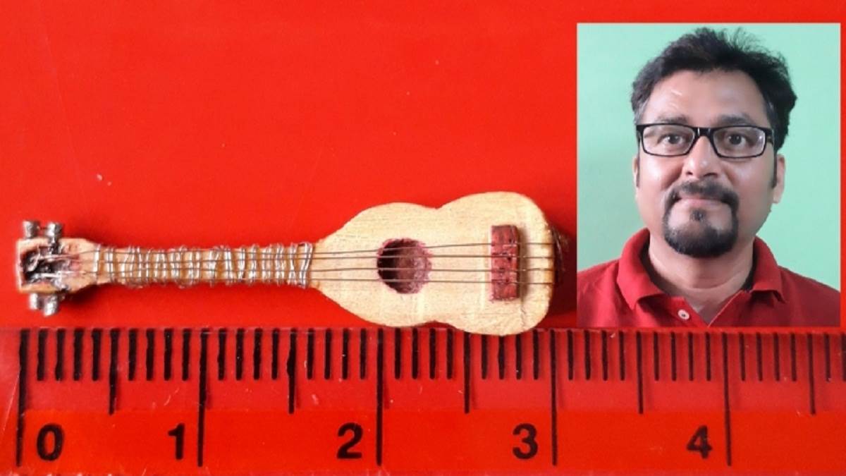 Smallest guitar in sales the world