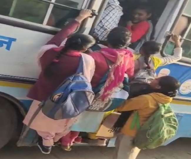 student forced to travel by hanging in bus in fatehabad video viral