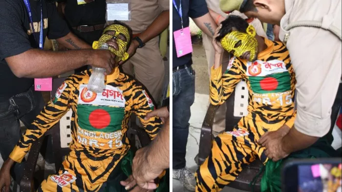 भारत बांग्लादेश टेस्ट मैच के दौरान दर्शक दीर्घा में बेहोश हुए बांग्लादेश के प्रशंसक टाइगर रूबी पानी पिलाता पुलिसकर्मी। जागरण