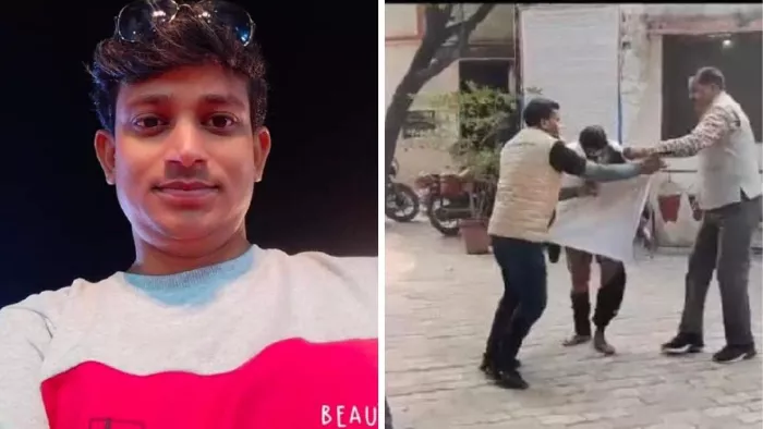 एसपी ऑफिस में आग से जले श्रीचंद्र को कपड़ो में लपेटती पुलिस।