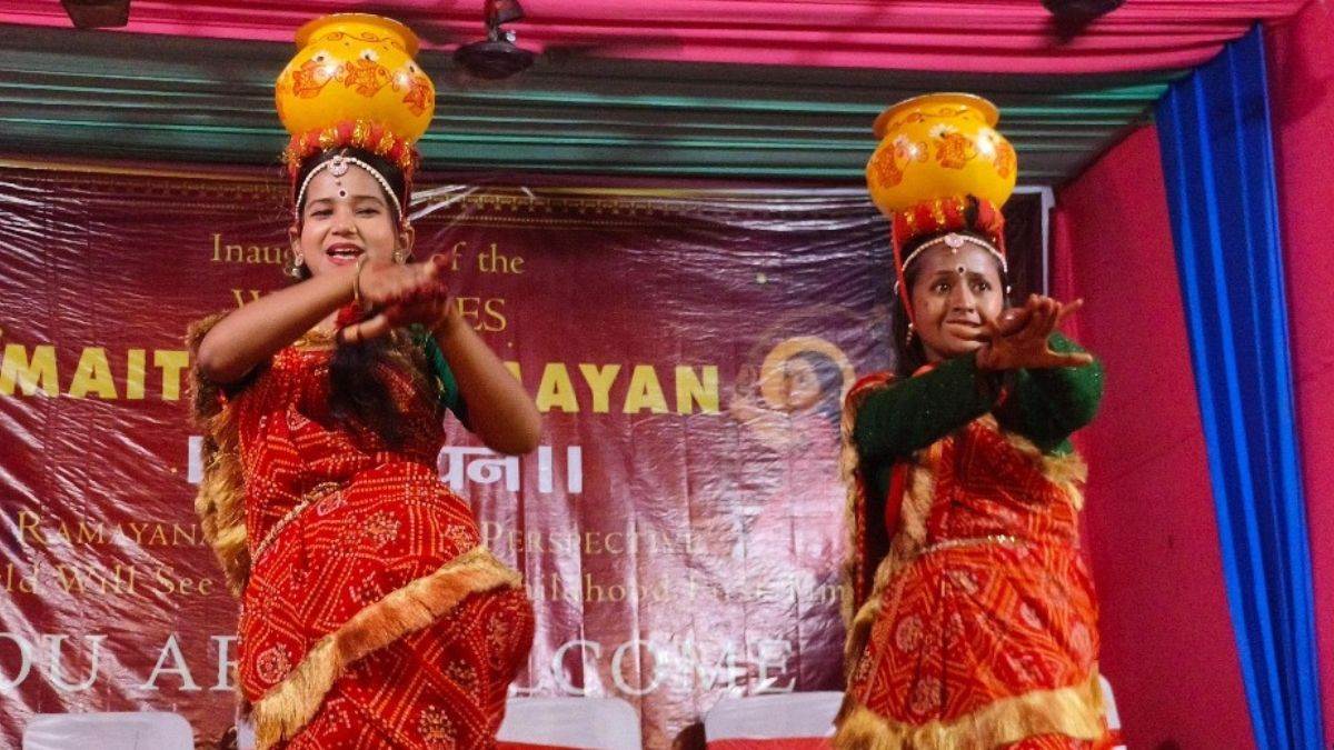 girls perform group dances with a burning lamp in a pot with hundreds of holes on their heads
