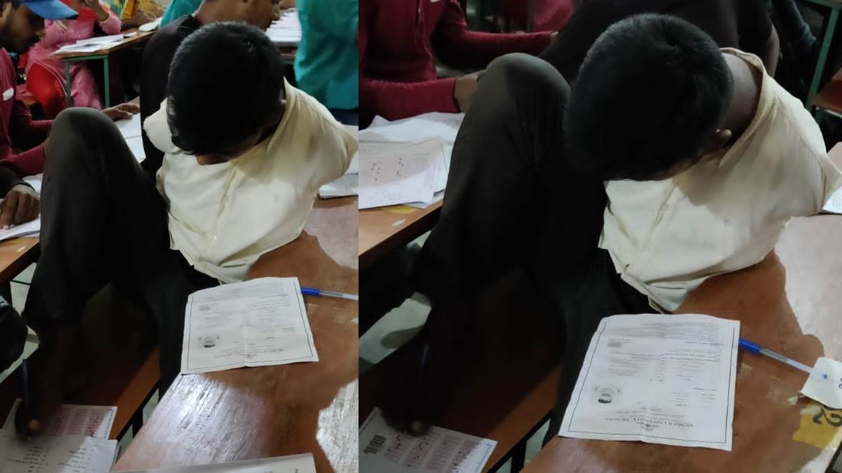 बिहार के मुंगेर का नंदलाल, जो स्‍नातक की परीक्षा पैर से लिखकर दे रहा है।