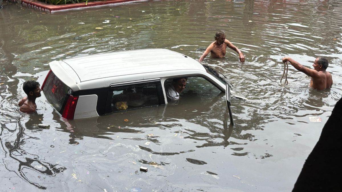 heavy rainfall in mathura city wagonr car submerged police safe persons traffic disrupted