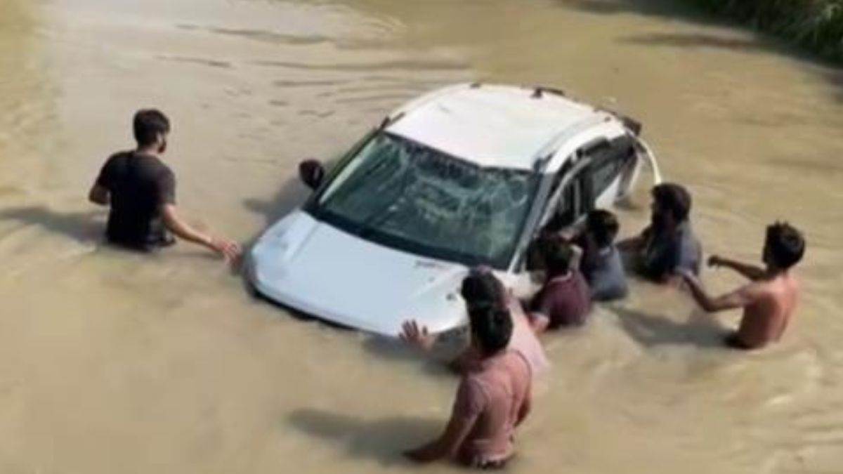 electric car plunges into ditch in hapur and villagers rescue occupants