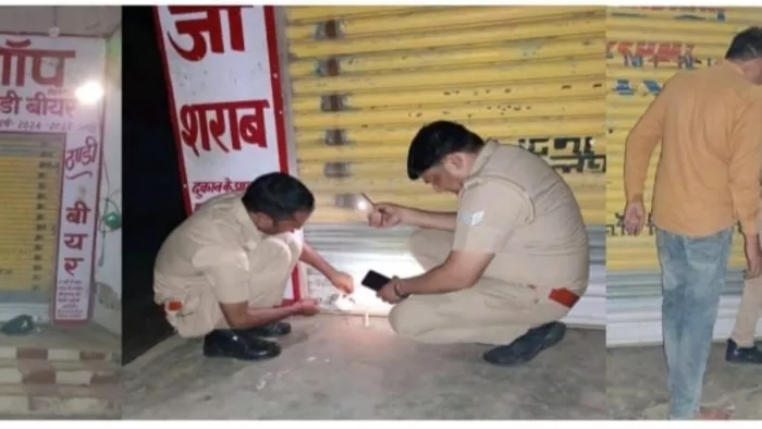 मॉडल शॉप पर सील लगाने की कार्रवाई करते पुलिसकर्मी।