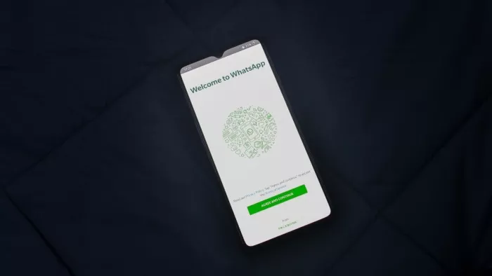 Process to disable message reaction notifications on WhatsApp