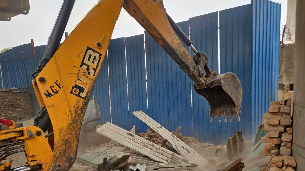 ncr faridabad news municipal corporation demolishes illegal constructions causing waterlogging
